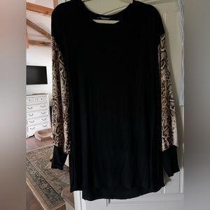 Size XL black shirt with snake skin sleeves.